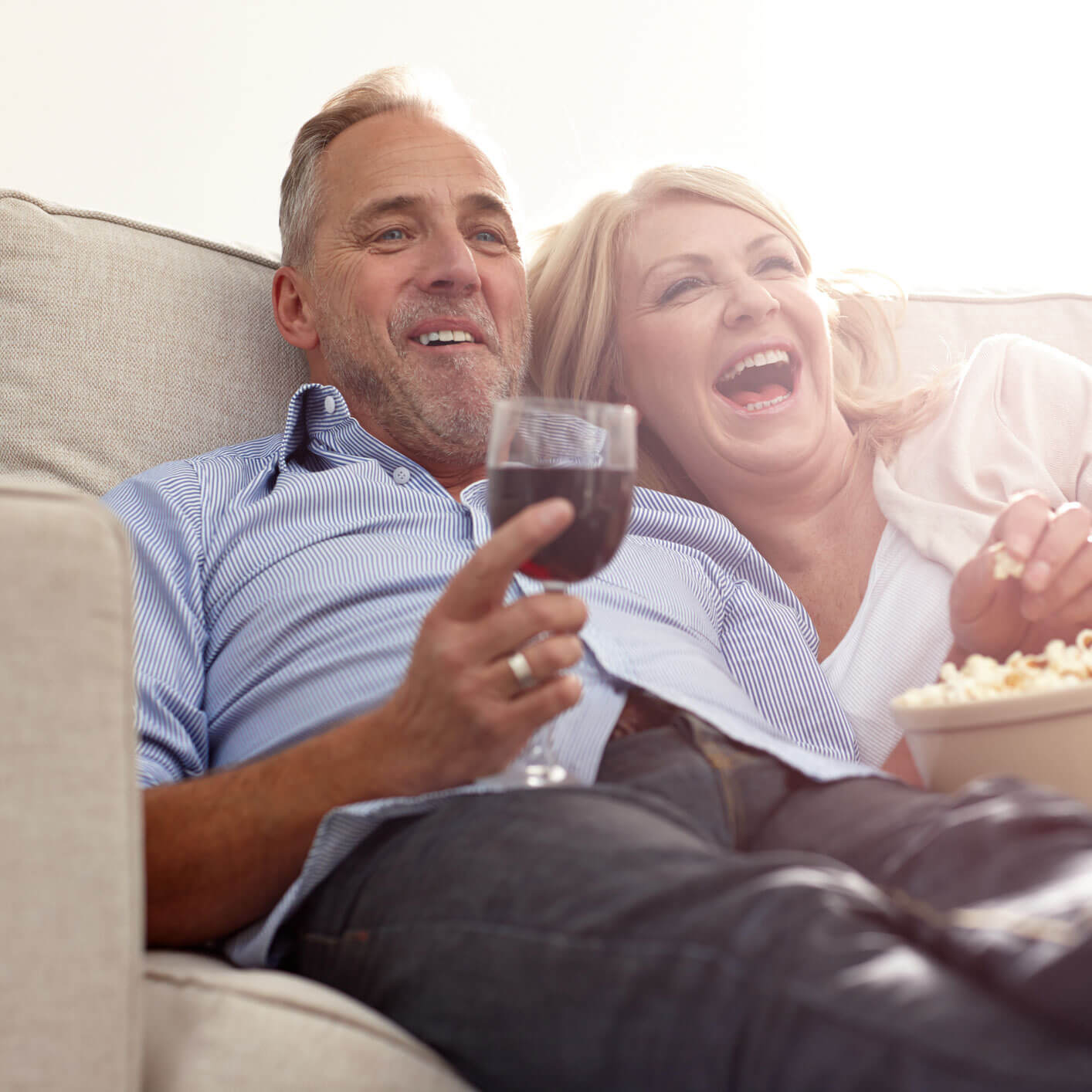couple enjoying wine on the couch